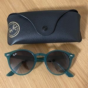 Ray-Ban sunglasses in a green/teal color
